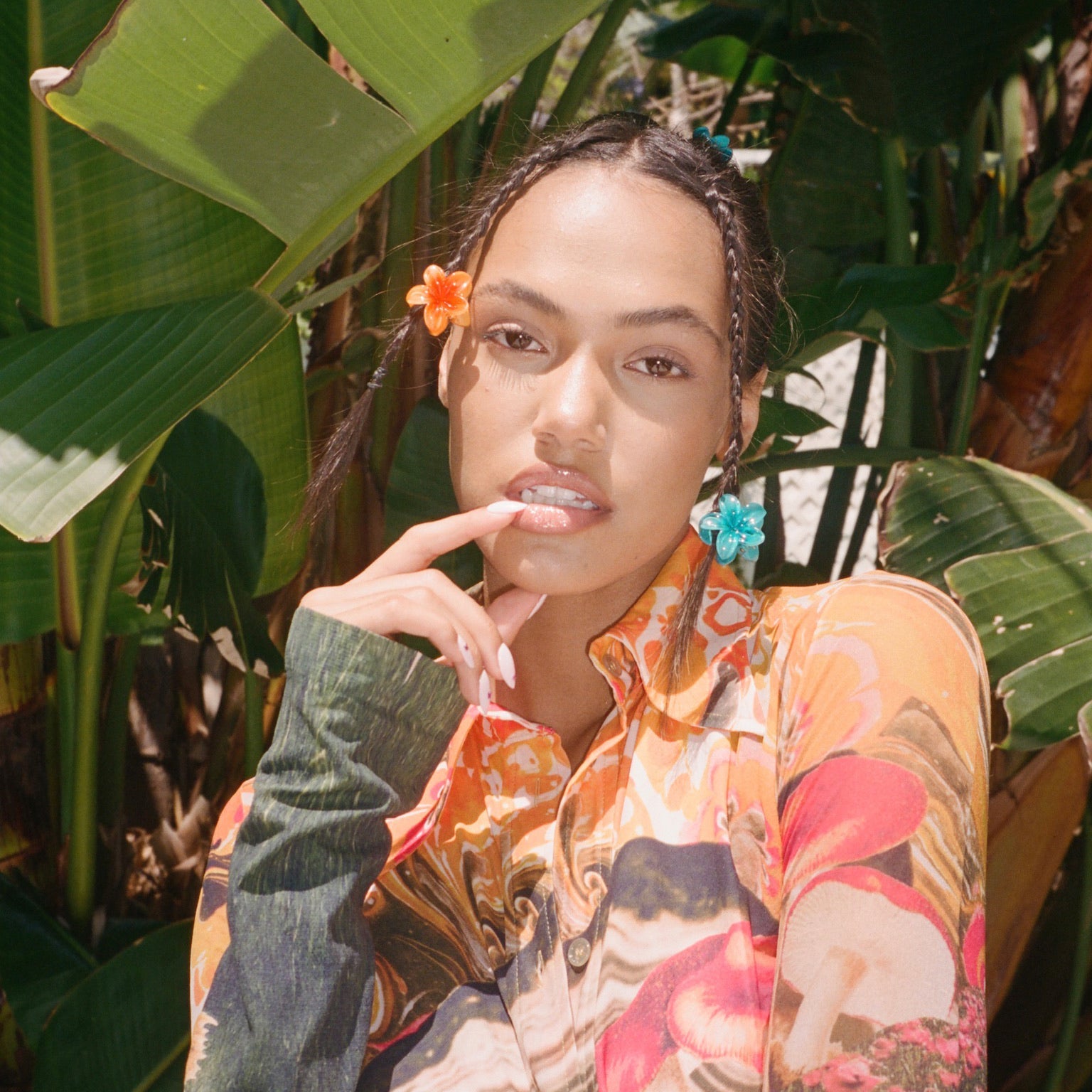 Model wearing braids with Baby Super Bloom Clip Set in Saltwater + Mango