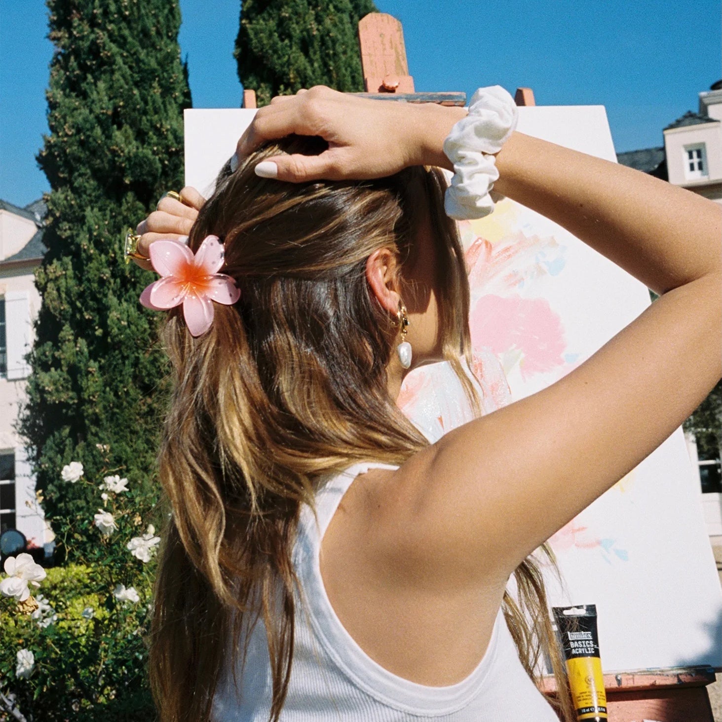 model wearing Super Bloom Clip in Guava in hair